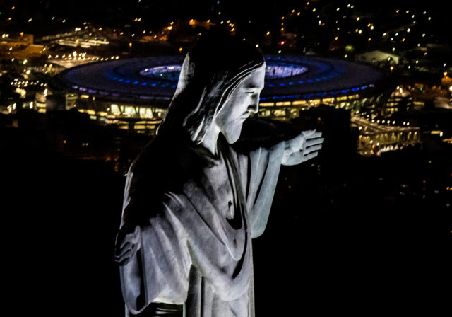 RIO2016_Previa-Ceremonia-Inaugural-Maracana_02 RIO DE JANEIRO, BRAZIL - JULY 31: The Christ the Redeemer statue and Maracana Stadium are seen on July 31, 2016 in Rio de Janeiro, Brazil. Rio 2016 will be the first Olympic Games in South America. The games begin August 5. (Photo by Buda Mendes/Getty Images)